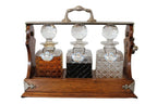 Antique English Oak Tantalus with Three Cut Crystal Decanters, c. late 1800s
