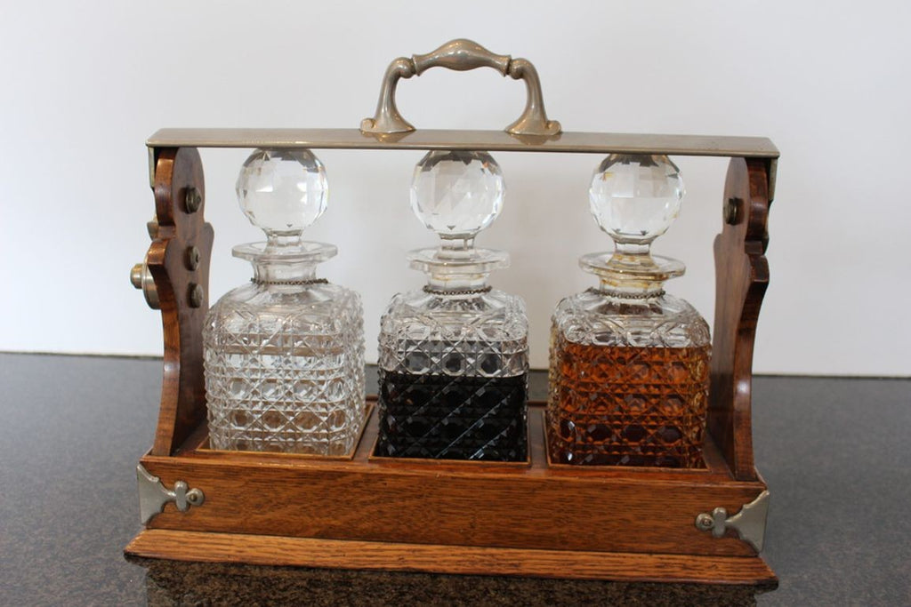 Antique English Oak Tantalus with Three Cut Crystal Decanters, c. late 1800s