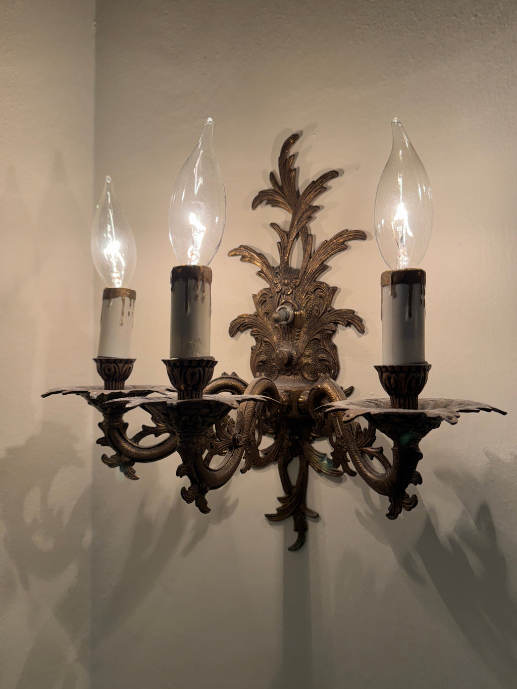 Pair of Vintage Bronze Three Arm Wall Sconces with White Candlesticks