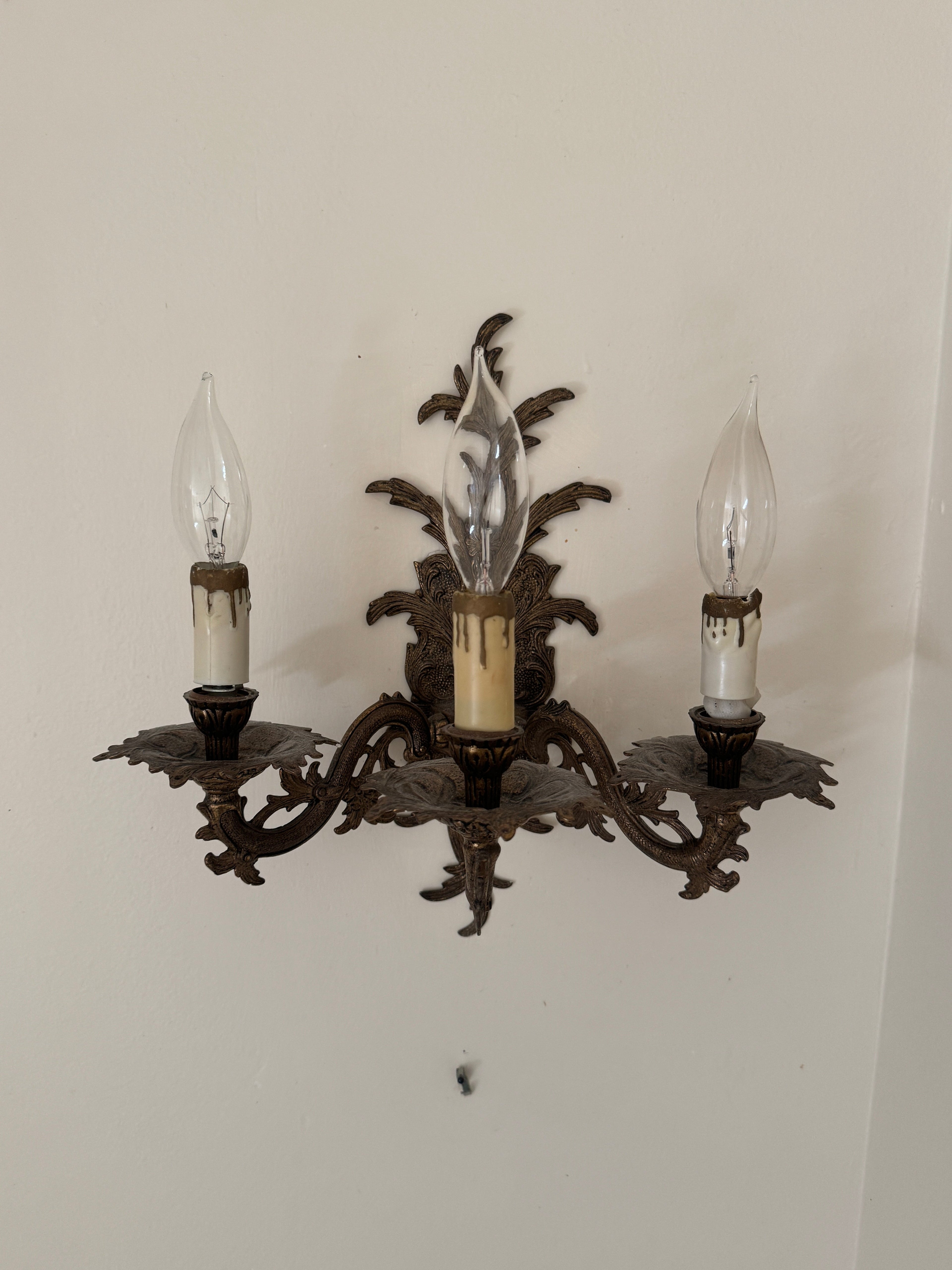 Pair of Vintage Bronze Three Arm Wall Sconces with White Candlesticks